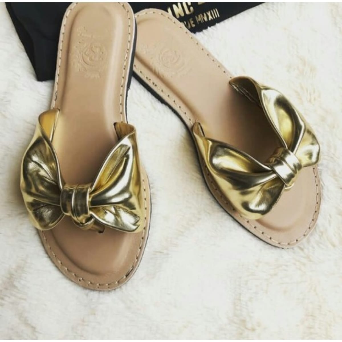 Gold leather store slippers