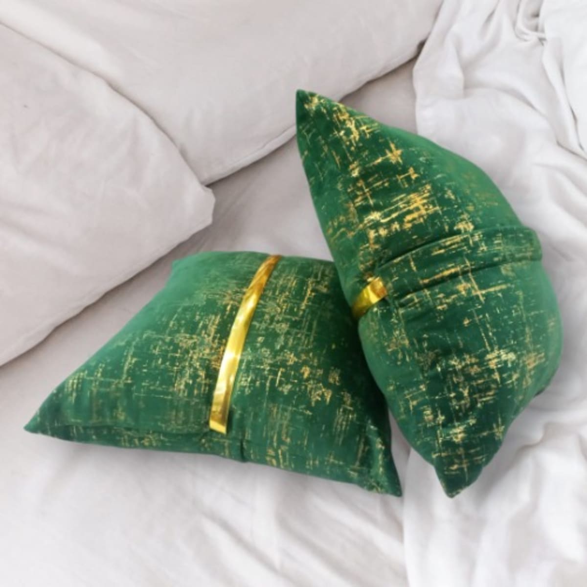 Green and gold throw pillows top