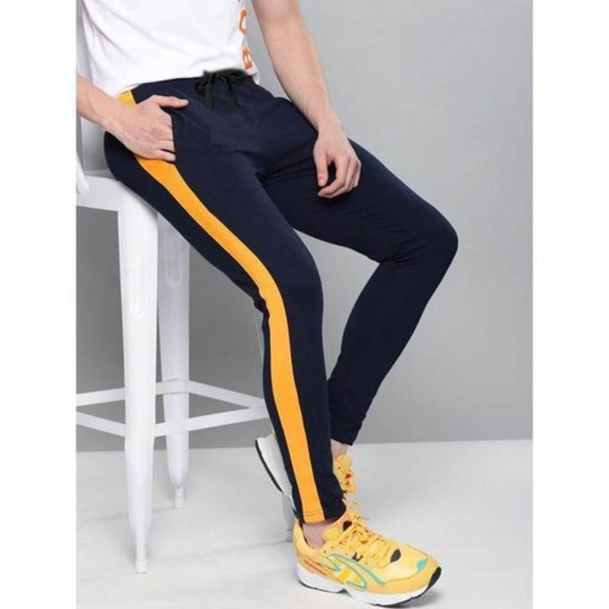 Black joggers store with blue stripe