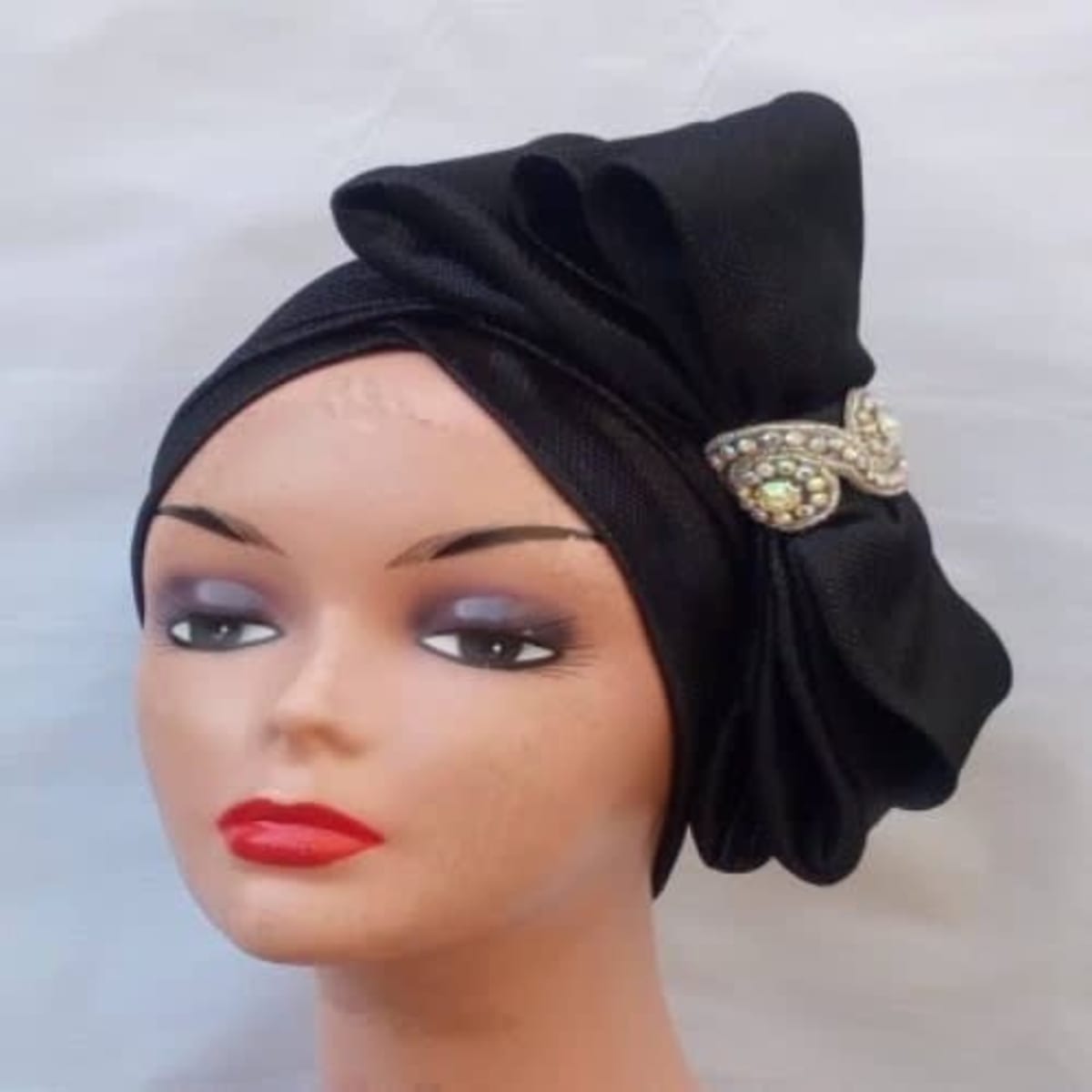 Turban with bow outlet