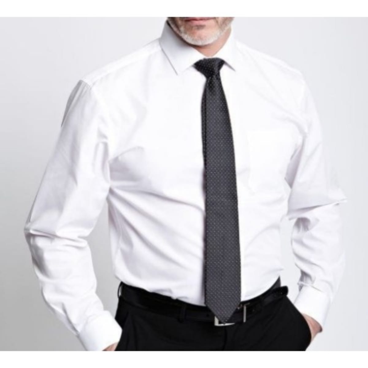 Cheerful Employee Man In White Shirt With Black Tie Keeping Hands In  Pockets And Smiling While Standing Isolated Grey Studio Background Stock  Photo - Download Image Now - iStock