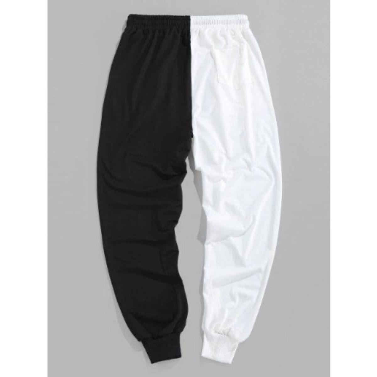 Half black store half white joggers