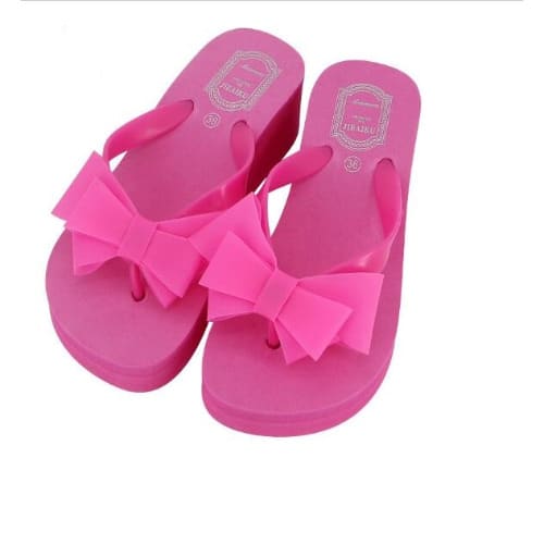Pink slippers with bow on sale